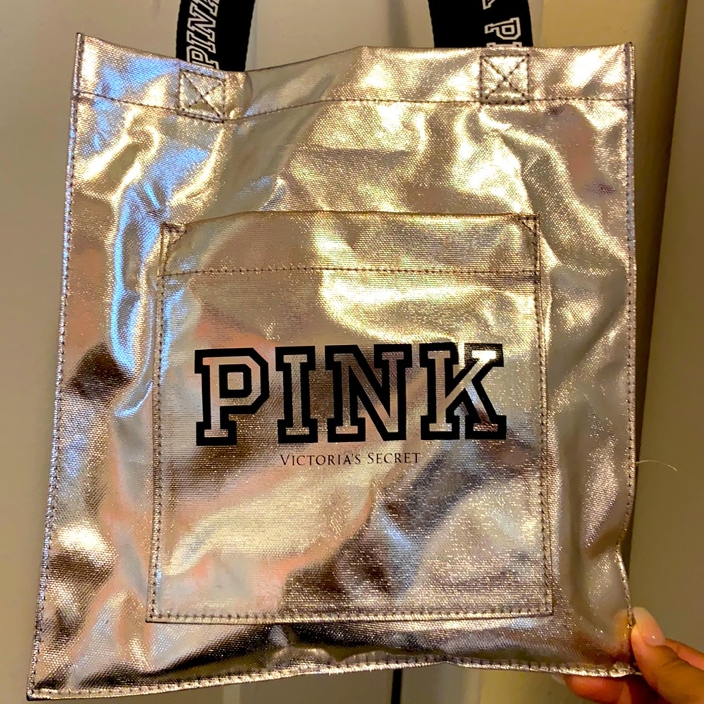 A silver mini bag with a small pocket in front.